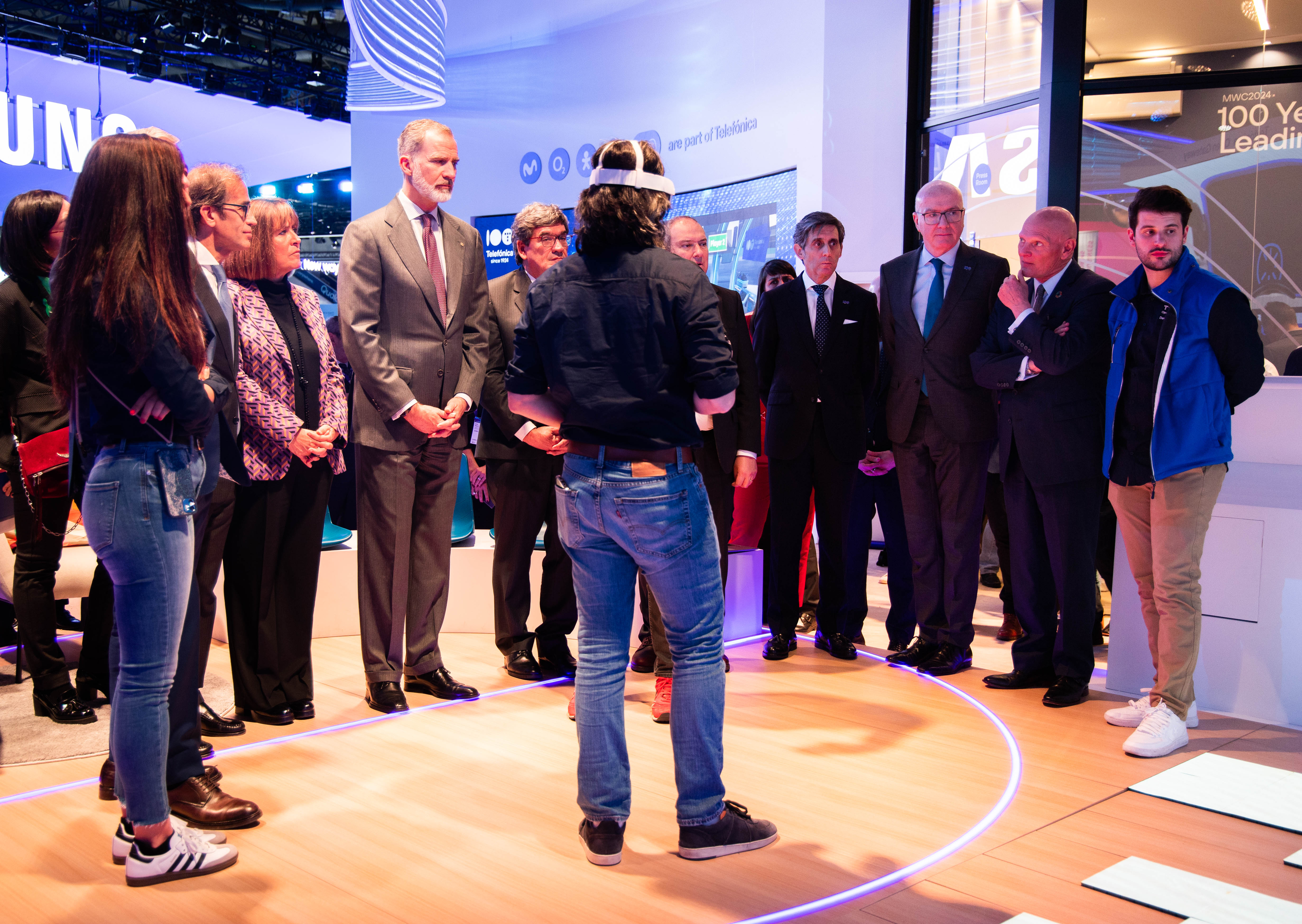 King Felipe attends a demo during his visit to the Telefónica stand at MWC 2024, accompanied by, among others, José Luis Escrivá, Minister for Digital Transformation and the Civil Service; Jordi Hereu, Minister of Industry and Tourism; Pau Relat, President of the Fira; Núría Marín, Mayor of Hospitalet; José María Álvarez-Pallete, Chairman of Telefónica and GSMA; Ángel Vilá, CEO of Telefónica; and John Hoffman, CEO of GSMA.