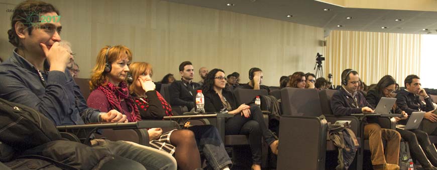 People listening the panelists during the DTL event