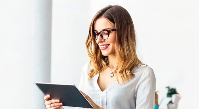 Woman viewing content in a tablet