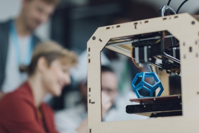 Creative Start-Up Business Team Working by 3D Printer