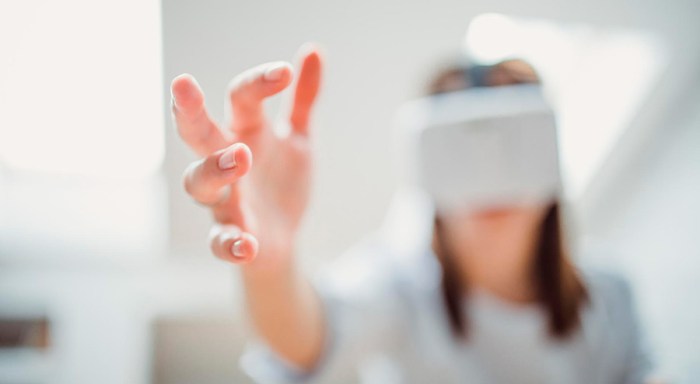 Young man using virtual reality glasses
