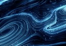 Digital generated image of glow fiber splines making turbulence patterns on black background