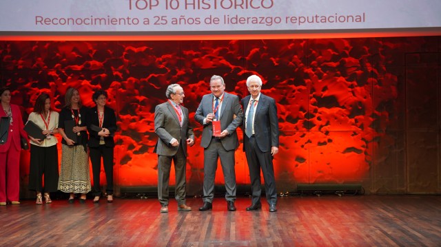 Eduardo Navarro, second from right, receives recognition from Merco.