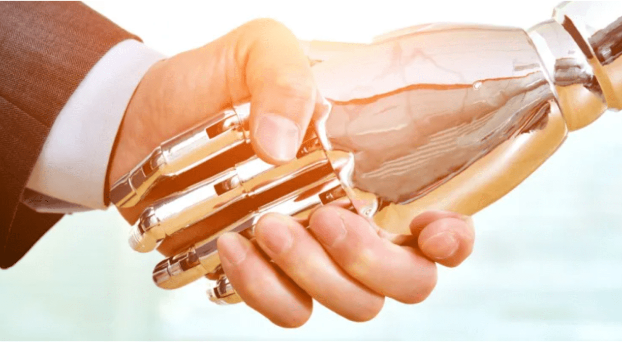 Apretón de manos entre robot y humano
