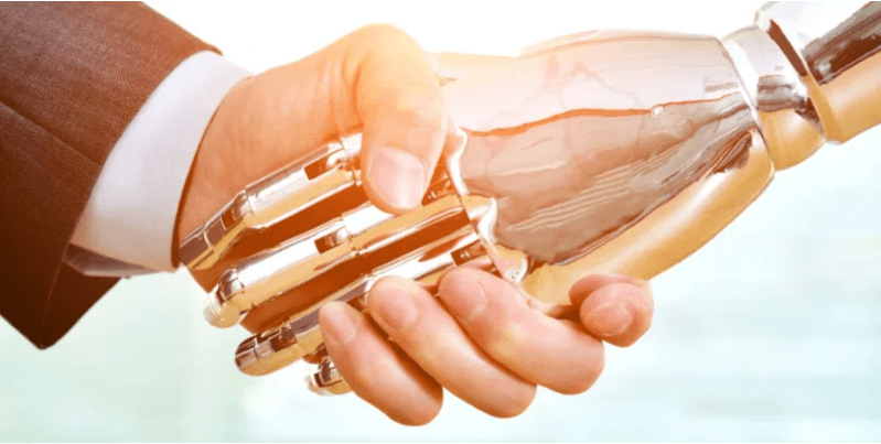 Apretón de manos entre robot y humano
